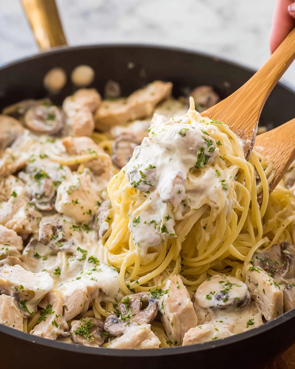 Creamy Chicken Fettuccine Alfredo with Mushrooms and Parsley Recipe - Recipe Image