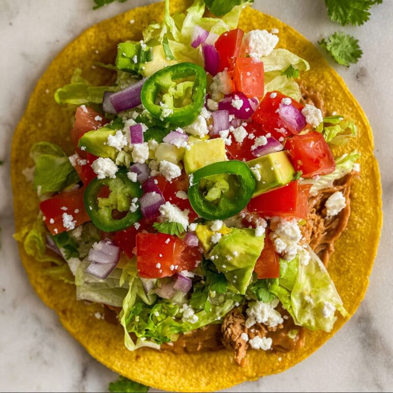 Creamy Pinto Bean Tostadas topped with Fresh Veggies and Queso Fresco Recipe